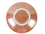 a brown and white plate with a brown design on it
