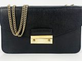 a black purse with a gold chain on it