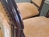 two chairs that are sitting next to each other in a room