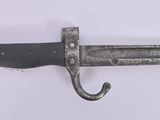 a close up of a knife on a white surface