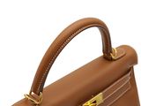 the handle of a brown leather handbag on a white background