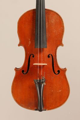 an old violin with a bow hanging from it ' s back
