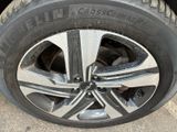 the tire of a car with a flat tire on the ground