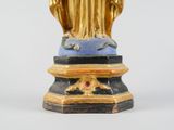 an image of a statue of a woman holding a child