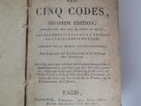 an old book opened to show the title of a novel