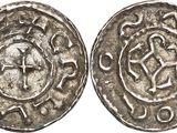 a silver coin with an image of a man on it
