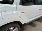 a picture of a white car parked in a parking lot