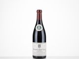 a bottle of red wine sitting on top of a white table