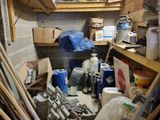 an image of a garage with a lot of clutter and tools