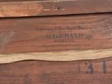 a close up of a wooden box with a label on it