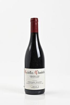a bottle of wine that is sitting on a table