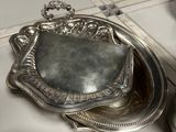 a silver tray with a mirror on top of it