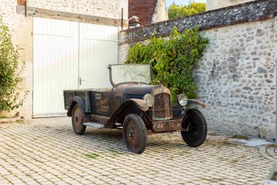 an old truck parked in front of a building
