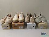 quatre paires de chaussures pour femmes sont alignées sur des boîtes