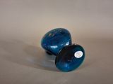 pair of blue glass vases sitting on top of a white surface
