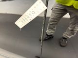 a man that is standing on a platform with a pole