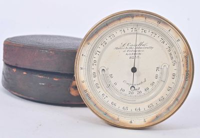 a clock that is sitting on top of a wooden box