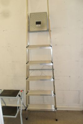 a ladder that is leaning against a wall in a room