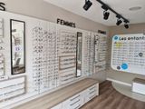 many glasses on the wall in the store