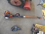 a picture of a lawn mower and tools laid out on the ground