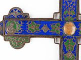 a blue and green cross on a white background