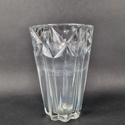 a glass vase that is sitting on a table