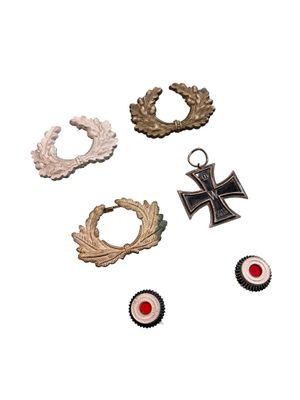 several different types of medals are displayed on a white surface
