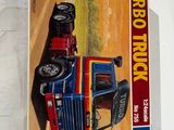 une image représentant une boîte sur laquelle figure l'image d'un camion