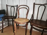 three chairs that are sitting on a table in a room