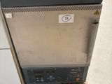 a small refrigerator sitting on a pallet in a warehouse