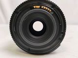 a close up of a camera lens on a white surface