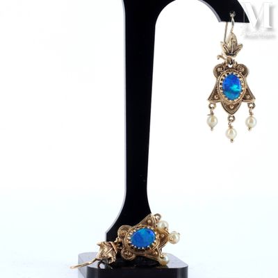 an image of a pair of earrings on a black stand