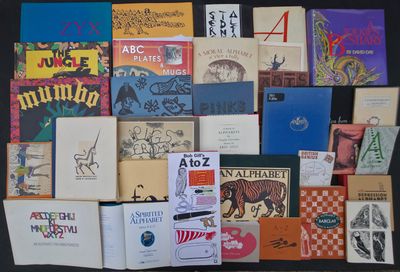 a lot of books that are on the table together