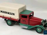a toy truck with a cover on the back of it