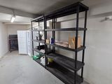a room with a shelf and a refrigerator in it