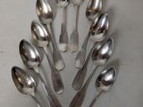 a lot of spoons arranged in a circle on the table