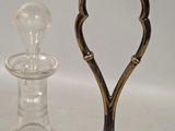 two glass decanters and a decanter on a table