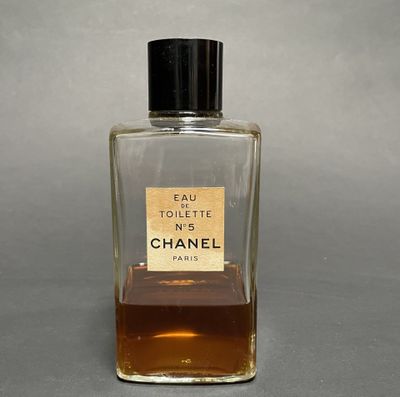 chanel eau toilette no 5 perfume bottle on a grey background
