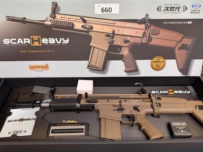 a box with a gun on it that is on display