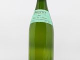 a bottle of wine that is sitting on a table