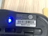 a close up of a computer mouse with a barcode on it