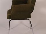 an image of a green chair with chrome legs and a buttoned back