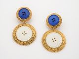 two pairs of blue and white buttons on a gold plated earring