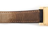 brown leather watch strap with gold buckle on a white background