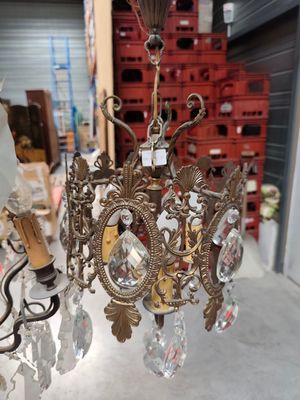 a chandelier that has a bunch of crystal beads hanging from it