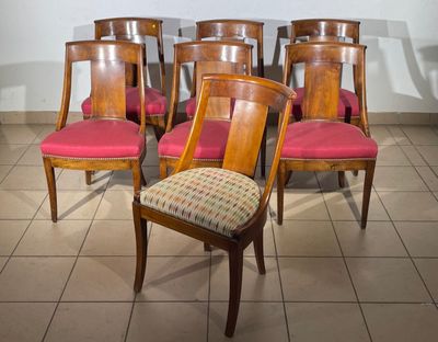 six chairs that are sitting on a tile floor