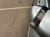 a parking meter on the side of a car