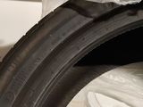 a close up of a tire on a plastic sheet