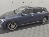 a blue mercedes suv parked in a garage