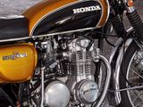 a yellow and black motorcycle parked in a garage